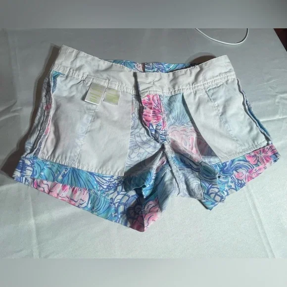 LILLY PULITZER "WALSH"
BLUE SHELL TO RAISE HAVEN
SHORTS SIZE- 00 - Picture 14 of 15